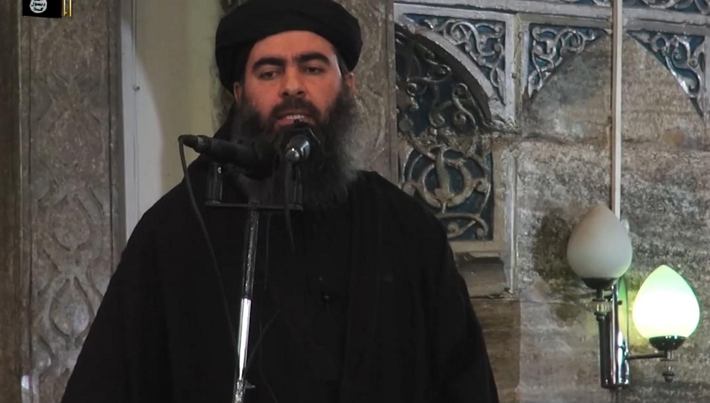 A file image grab from a propaganda video allegedly shows the leader of the Islamic State militant group, Abu Bakr al-Baghdadi. On May 14, 2015, Baghdadi urged Muslims to emigrate to his self-proclaimed "caliphate", in the jihadist supremo's first au