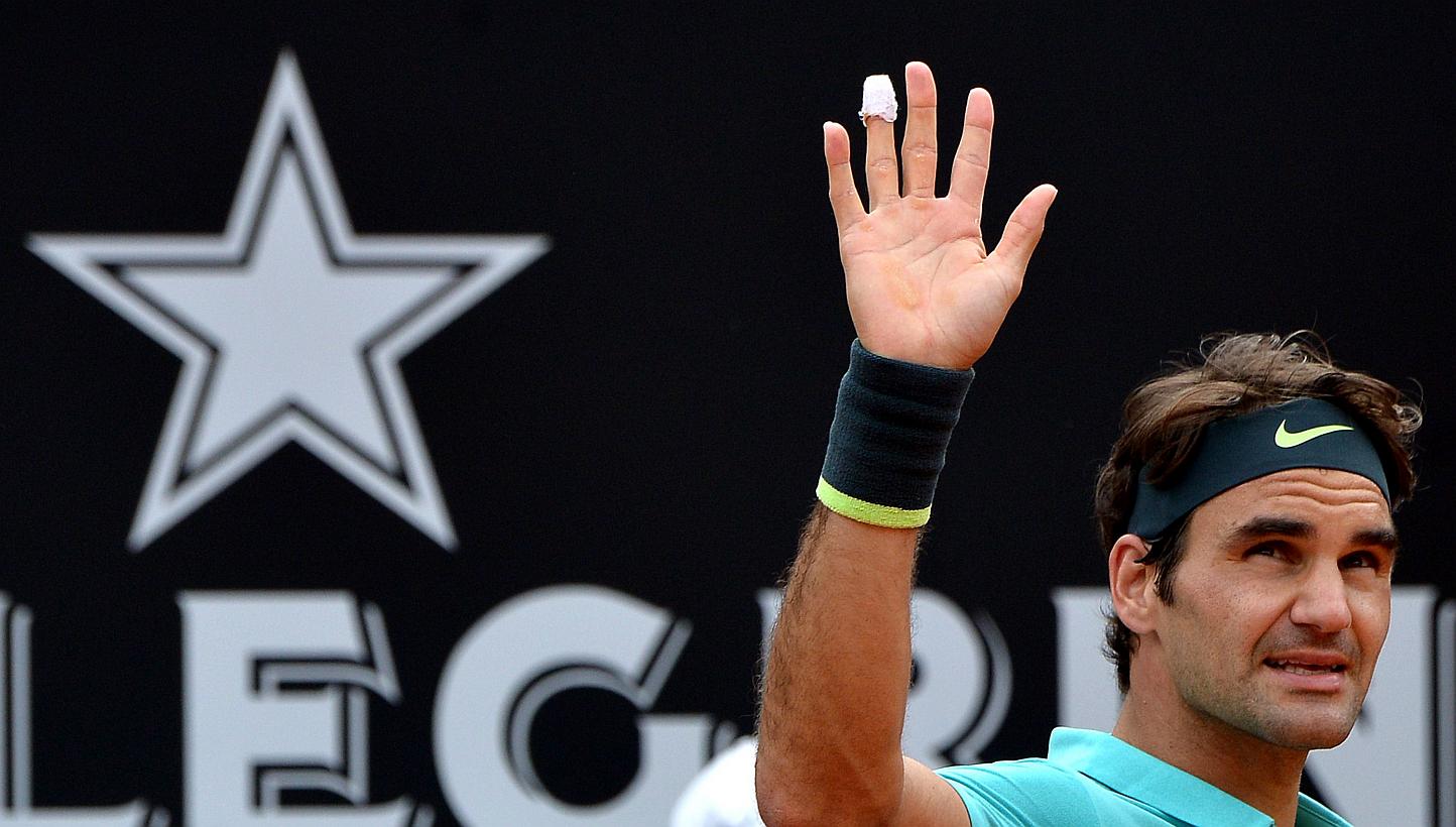 Swiss tennis player Roger Federer celebrates after winning against South African Kevin Anderson during the Italian Open on May 14, 2015 in Rome. -- PHOTO: AFP