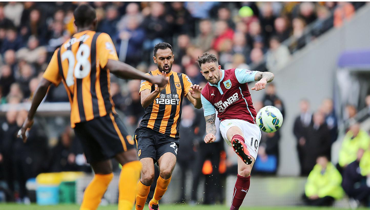 Danny Ings (right) of Burnley in action with Ahmed Elmohamady of Hull City. Hull City lost 1-0.. -- PHOTO: REUTERS
