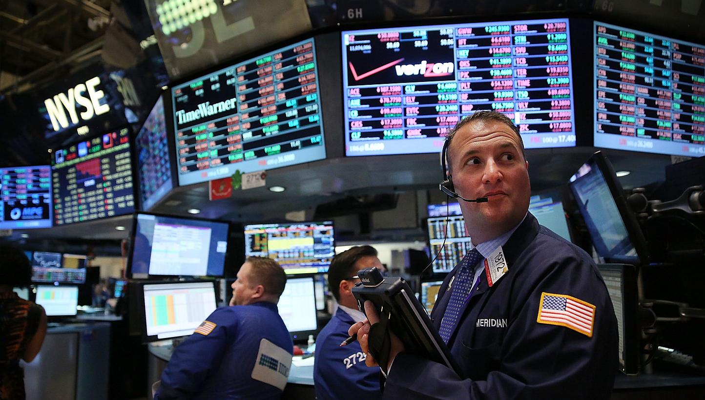 Traders working on the floor of the New York Stock Exchange (NYSE). -- PHOTO: AFP