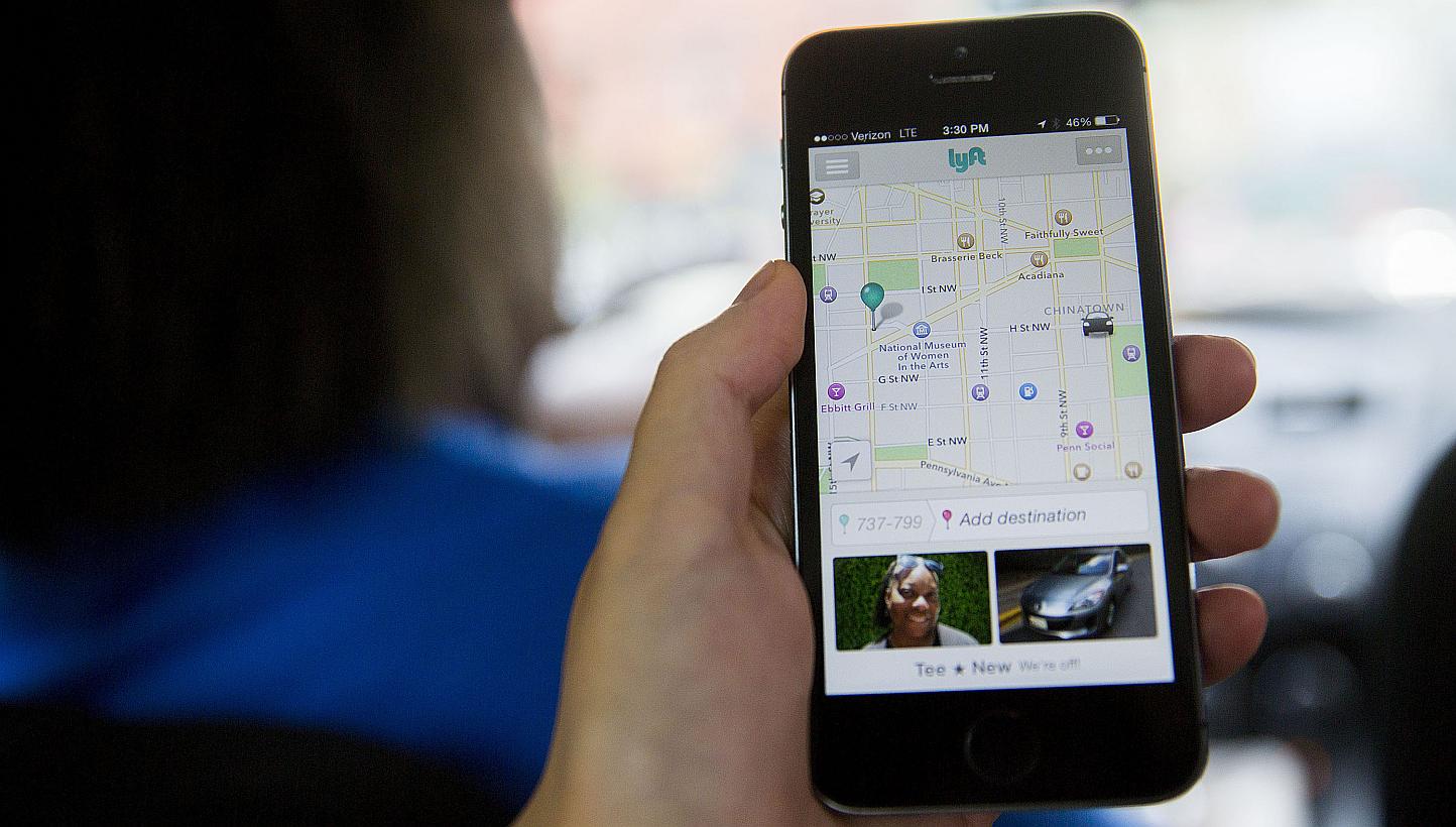 The Lyft app is displayed on a smartphone on July 9, 2014. Investor Carl Icahn's Icahn Enterprises has made a US$100 million (S$132 million) investment in Lyft, adding momentum to the ride-sharing company's rapid expansion but leaving its cash pile f