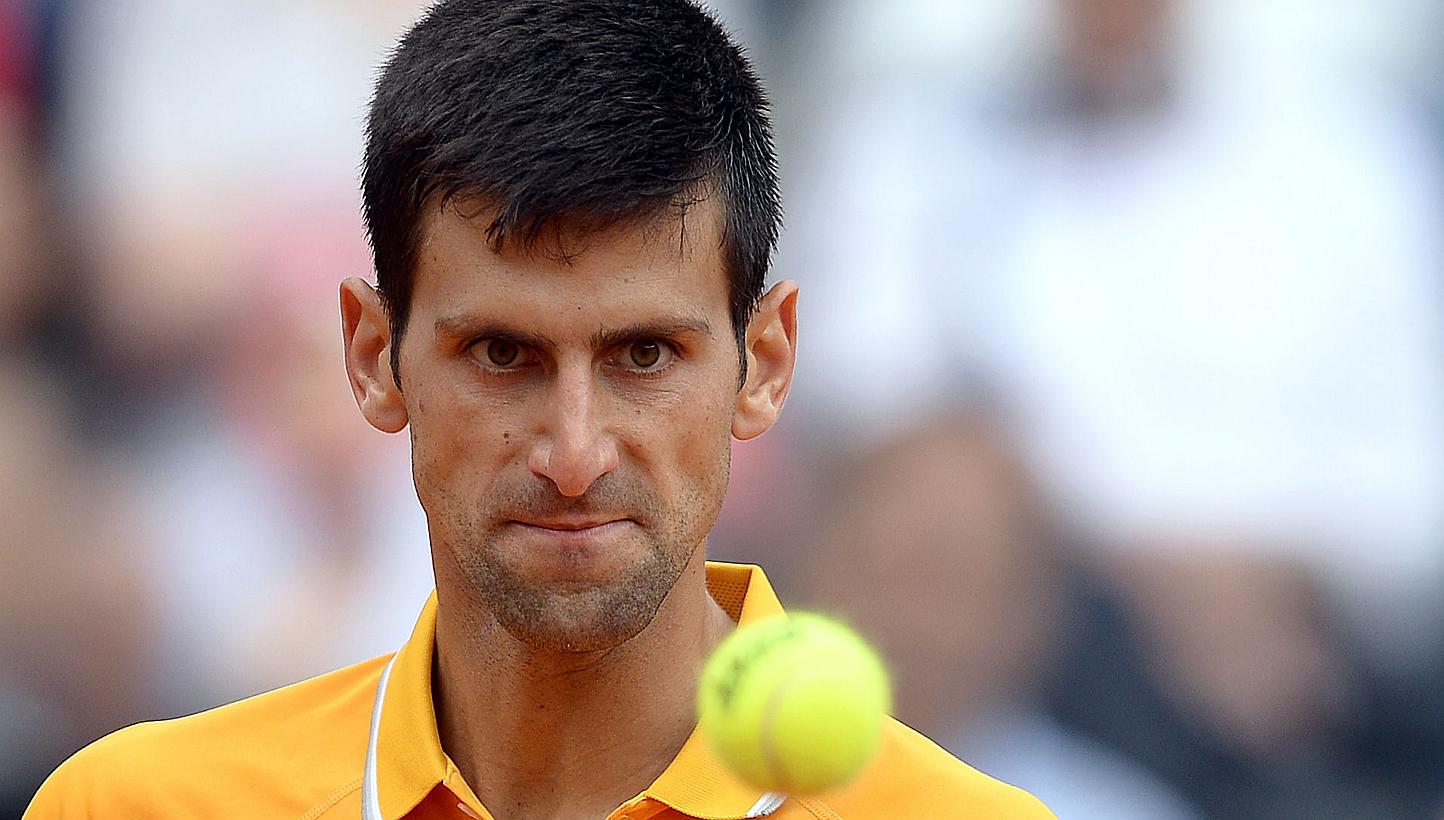 Novak Djokovic of Serbia eyes the ball during the semi final match against David Ferrer of Spain at the Italian Open on May 16, 2015, in Rome. -- PHOTO: AFP