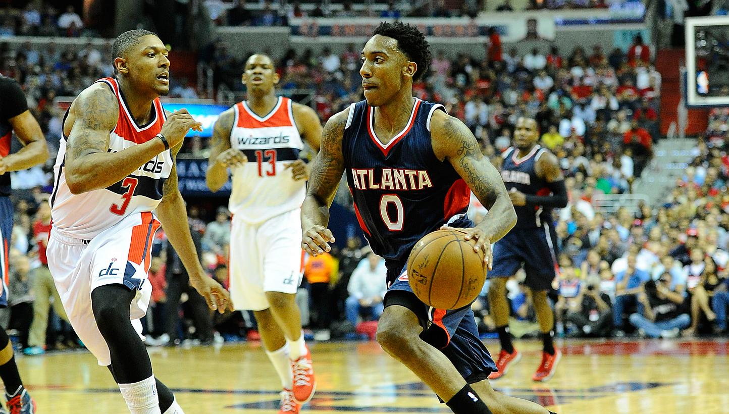 Atlanta Hawks guard Jeff Teague (right) dribbles past Washington Wizards guard Bradley Beal (left) during the first half in game six of the second round of the NBA Playoffs at Verizon Center. -- PHOTO: USA TODAY SPORTS 