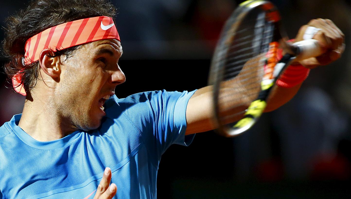 Rafael Nadal of Spain returns the ball to Stan Wawrinka of Switzerland during their men's quarter-final match at the Rome Open tennis tournament in Rome, Italy, May 15, 2015. -- PHOTO: REUTERS