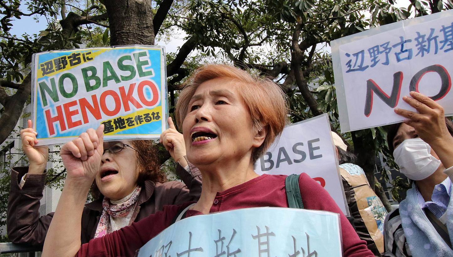 Activists shout slogans during a rally in front of the prime minister's official residence in Tokyo on April 17, 2015. Thousands of people rallied in Okinawa in southern Japan on Sunday in protest against a controversial United States airbase on the 