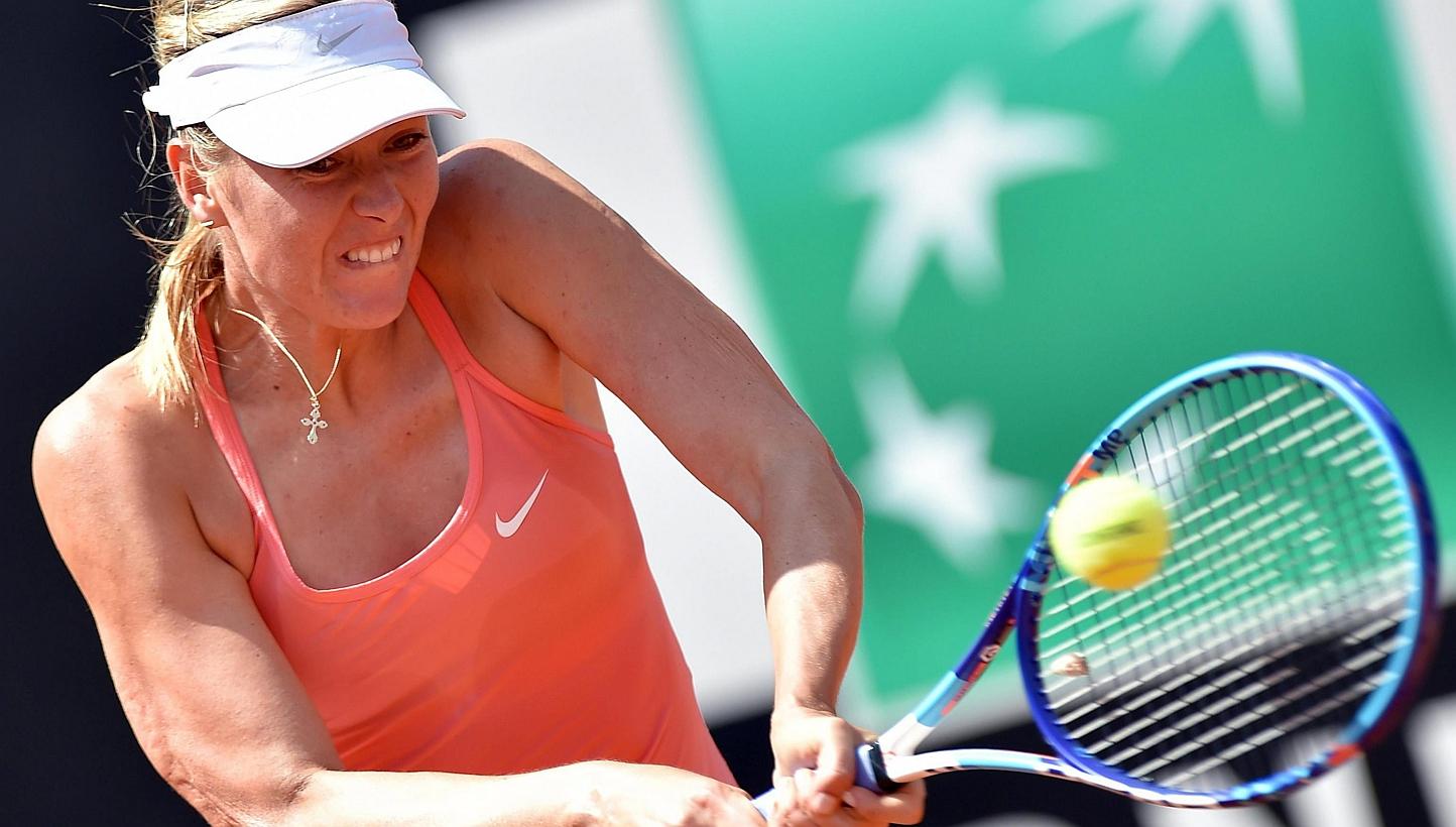 Maria Sharapova of Russia returns the ball to Carla Suarez Navarro of Spain during their final match for the Italian Open tennis tournament at the Foro Italico in Rome on Sunday. -- PHOTO: EPA