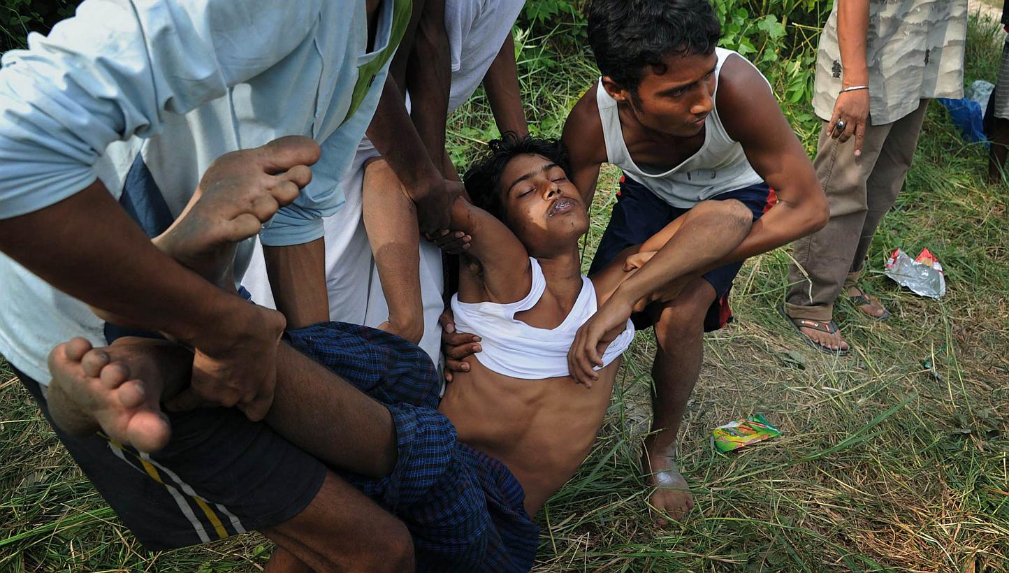 A rescued migrant being carried to an ambulance after his arrival at Kuala Langsa in Aceh last Friday. With thousands of boat people from Myanmar having been stranded at sea in recent weeks, such images could well strain its relations with the West a
