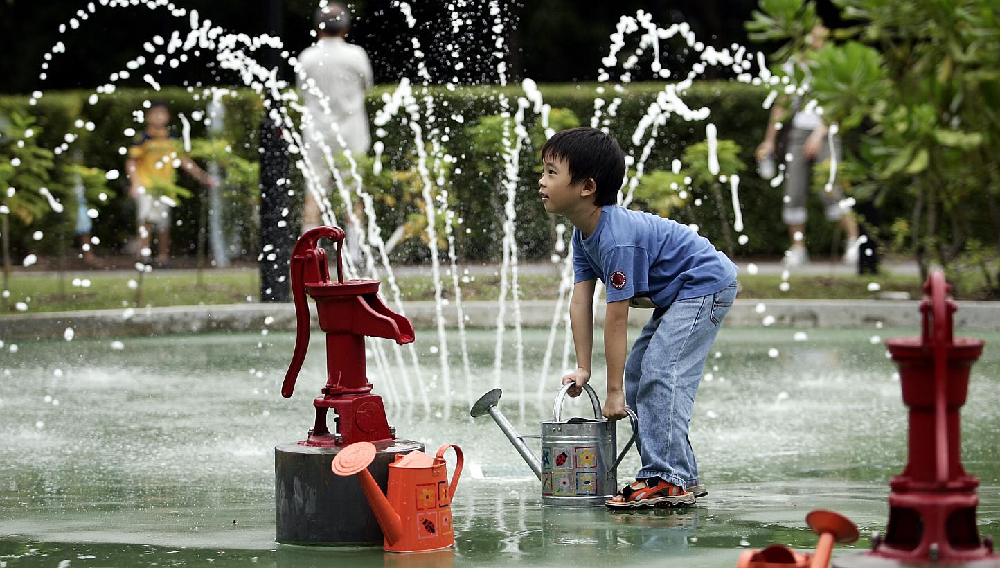 Dave Tan, six, preparing to water the plants in the WaterPlay Area of Asia’s first dedicated garden for children under 13. A growing group of scientists, education researchers and educators say there is little evidence to show that an early start i