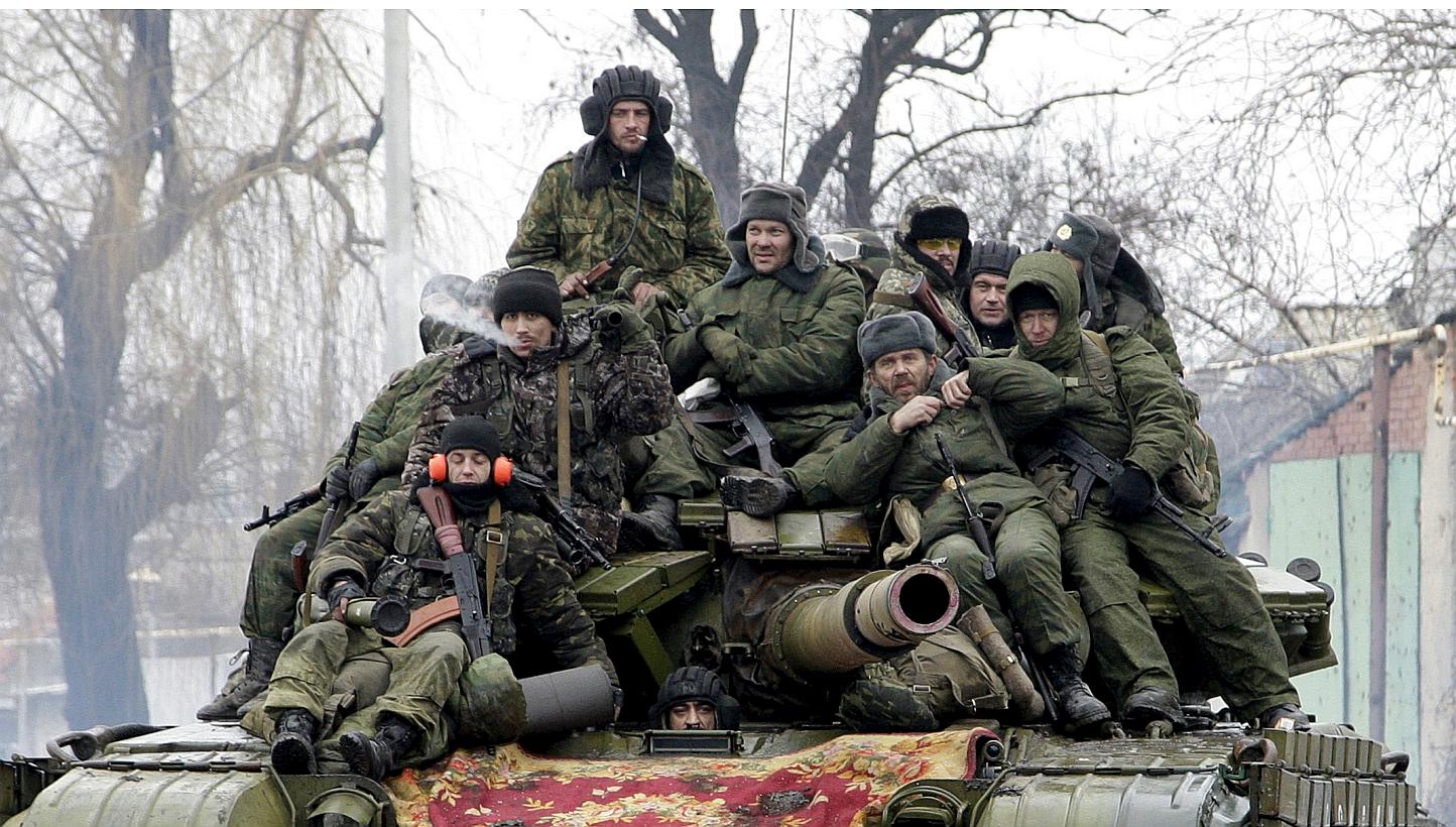 Members of the armed forces of the separatist self-proclaimed Donetsk People's Republic drive a tank on the outskirts of Donetsk, Ukraine, in this Jan 22, 2015 file photo. The Kremlin reiterated on Monday, May 18, that there were no regular Russ