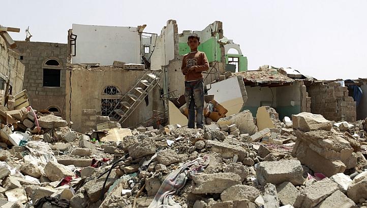  A Yemeni boy stands amidst the rubble of houses destroyed by Saudi-led air strike on a residential area last month, in the capital Sanaa, on Monday. Saudi-led coalition warplanes resumed strikes on rebel positions in southern Yemen after a five