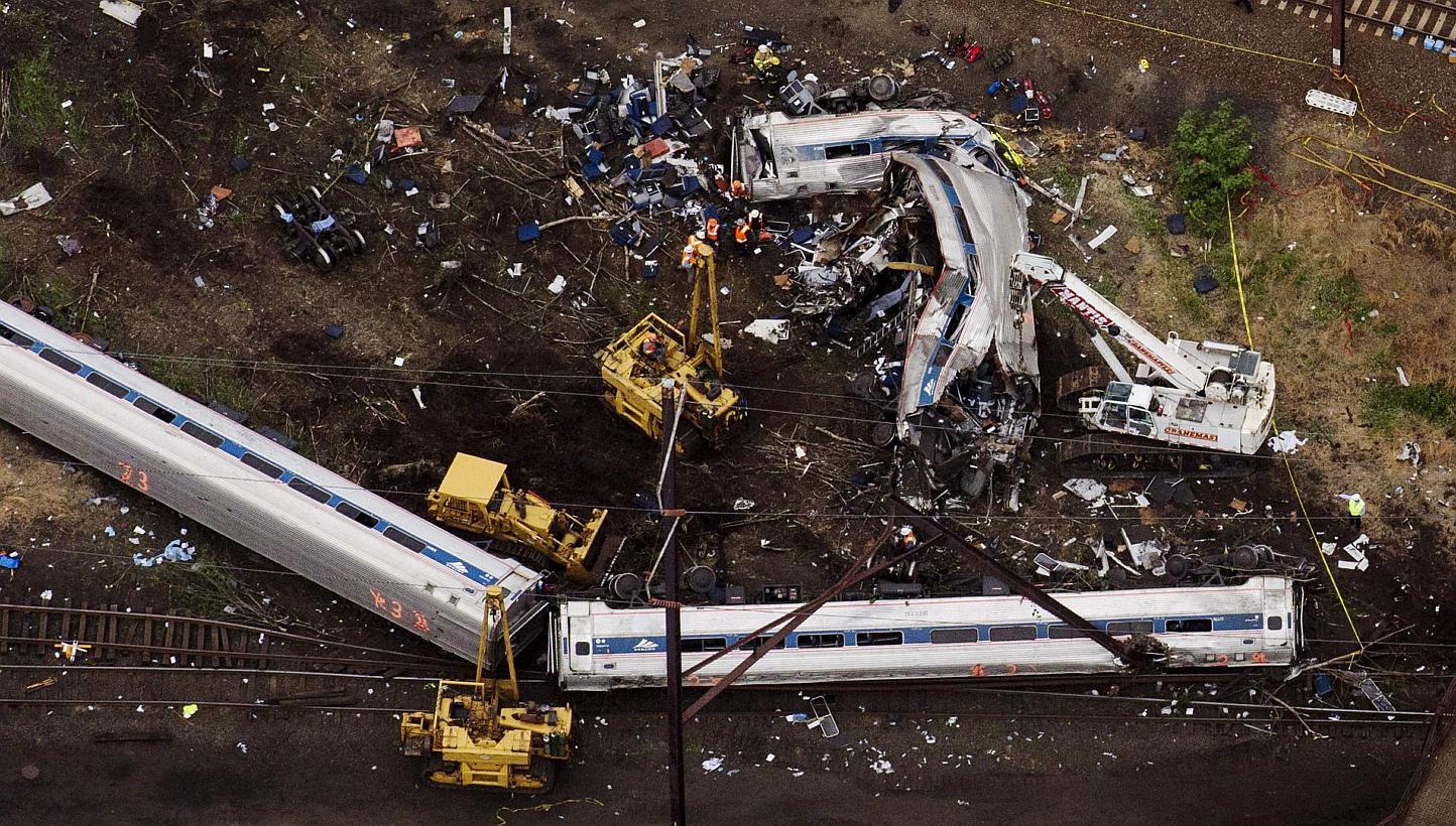 Emergency workers looking through the remains of a derailed Amtrak train in Philadelphia, Pennsylvania. -- PHOTO: REUTERS&nbsp;