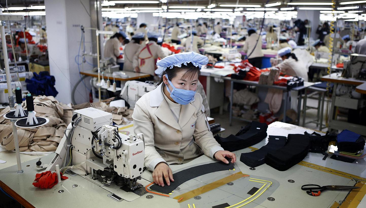 A North Korean employee works in a factory of a South Korean company at the Joint Industrial Park in Kaesong industrial zone on Dec 19, 2013. United Nations Secretary-General Ban Ki Moon has announced he will pay a visit to the the Kaesong Industrial
