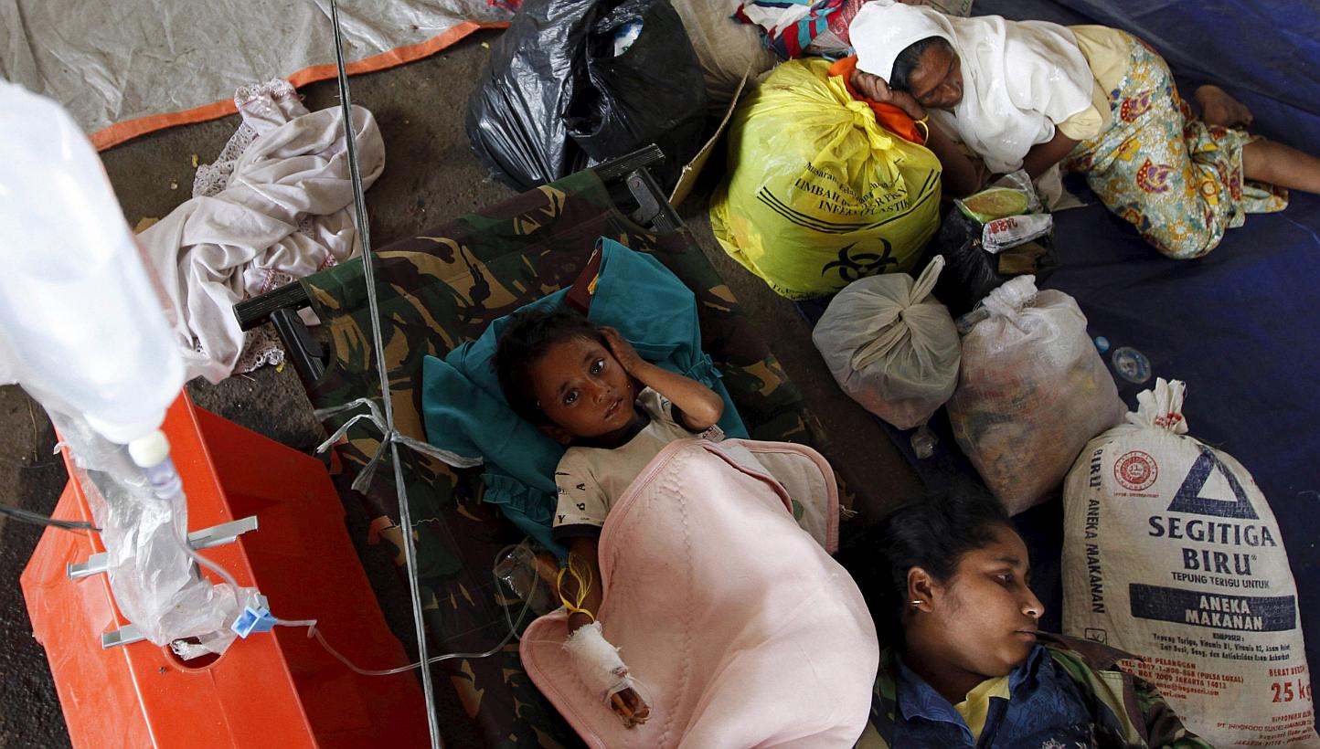 Rohingyas from Myanmar receiving medical assistance at a shelter in Kuala Langsa, Aceh province, on Sunday. Indonesia has taken in about 1,400 immigrants in Aceh, but say that many migrants it encounters are bound for Malaysia. So far, there are over