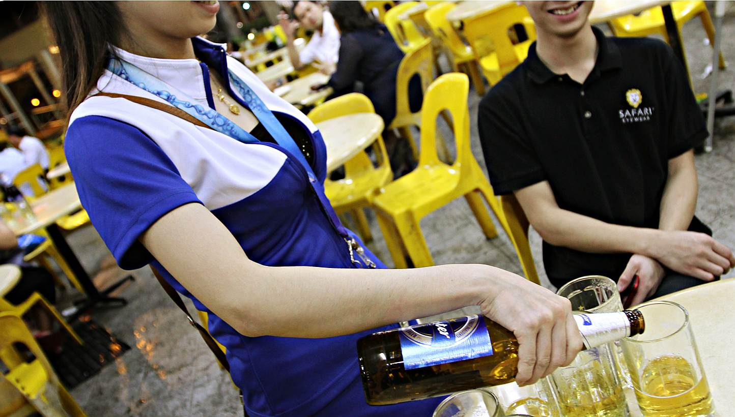 Breweries have been asked to withdraw their beer promoters from the 107 markets and hawker centres managed by the National Environment Agency (NEA), The Straits Times understands.&nbsp;&nbsp;-- PHOTO: THE NEW PAPER&nbsp;