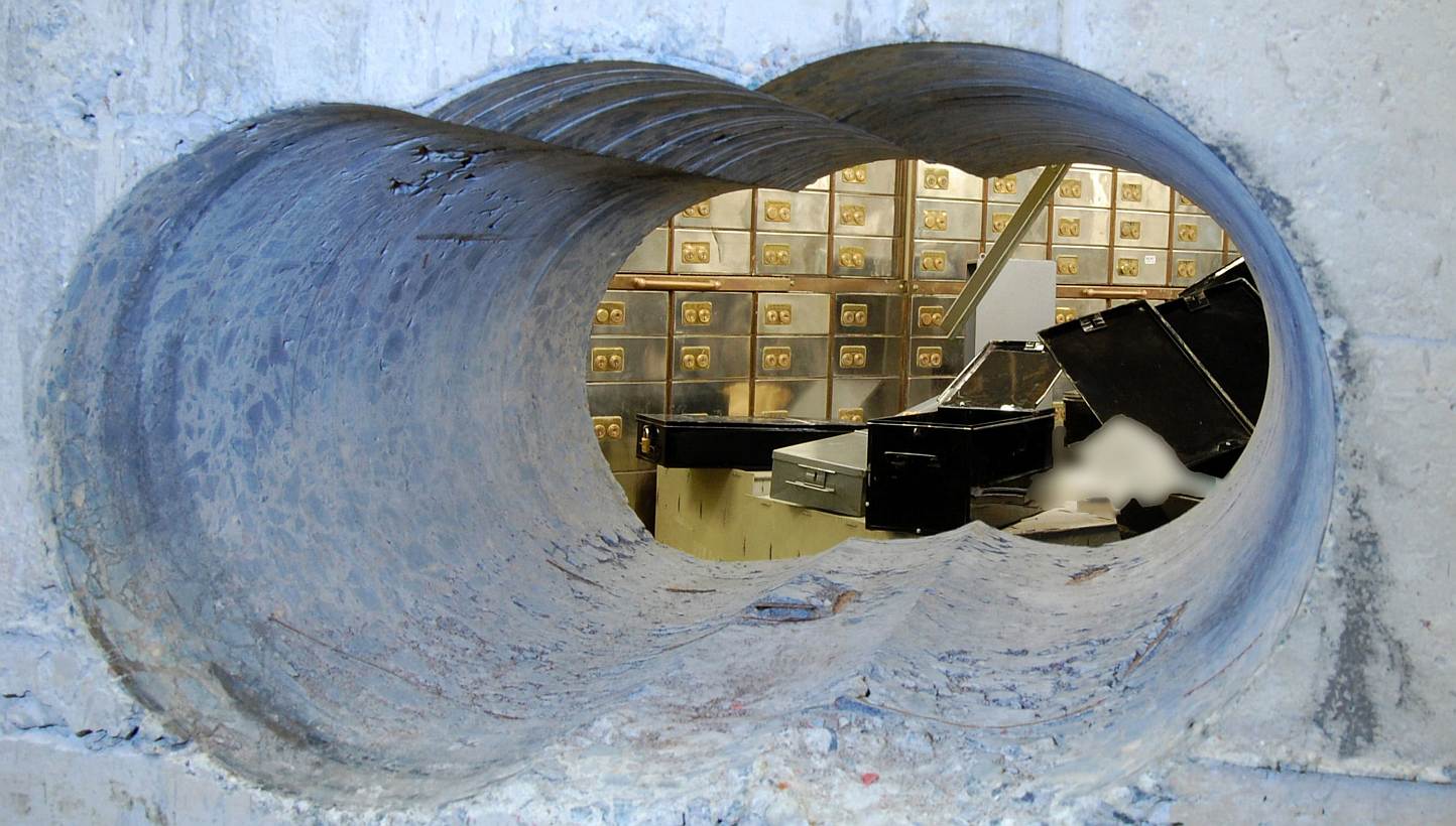Holes bored through a half-metre thick concrete wall drilled to access a vault in a safe deposit centre in Hatton Garden, London. -- PHOTO: AFP/BRITISH METROPOLITAN POLICE&nbsp;