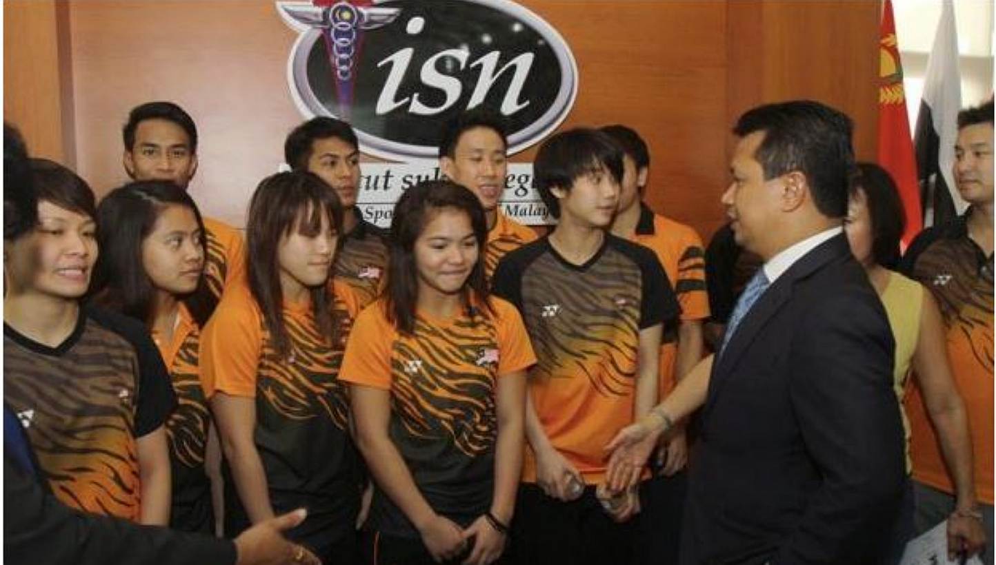 Malaysia's SEA Games chef-de-mission Norza Zakaria (right) speaking with the Malaysian national divers at the National Institute of Sport in Bukit Jalil on May 8, 2015. Datuk Seri Norza said he wants the Malaysian contingent to toe the line at next m
