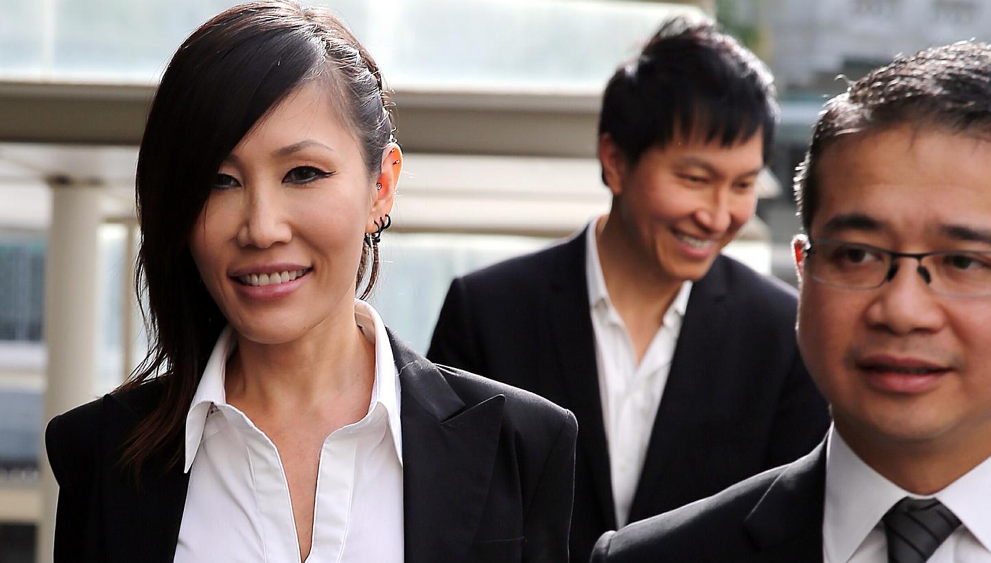 Pop singer Sun Ho (left) arriving at the State Courts on May 19, 2015, with her husband Kong Hee (centre), founder of City Harvest Church, and Senior Counsel Edwin Tong. -- PHOTO: WONG KWAI CHOW