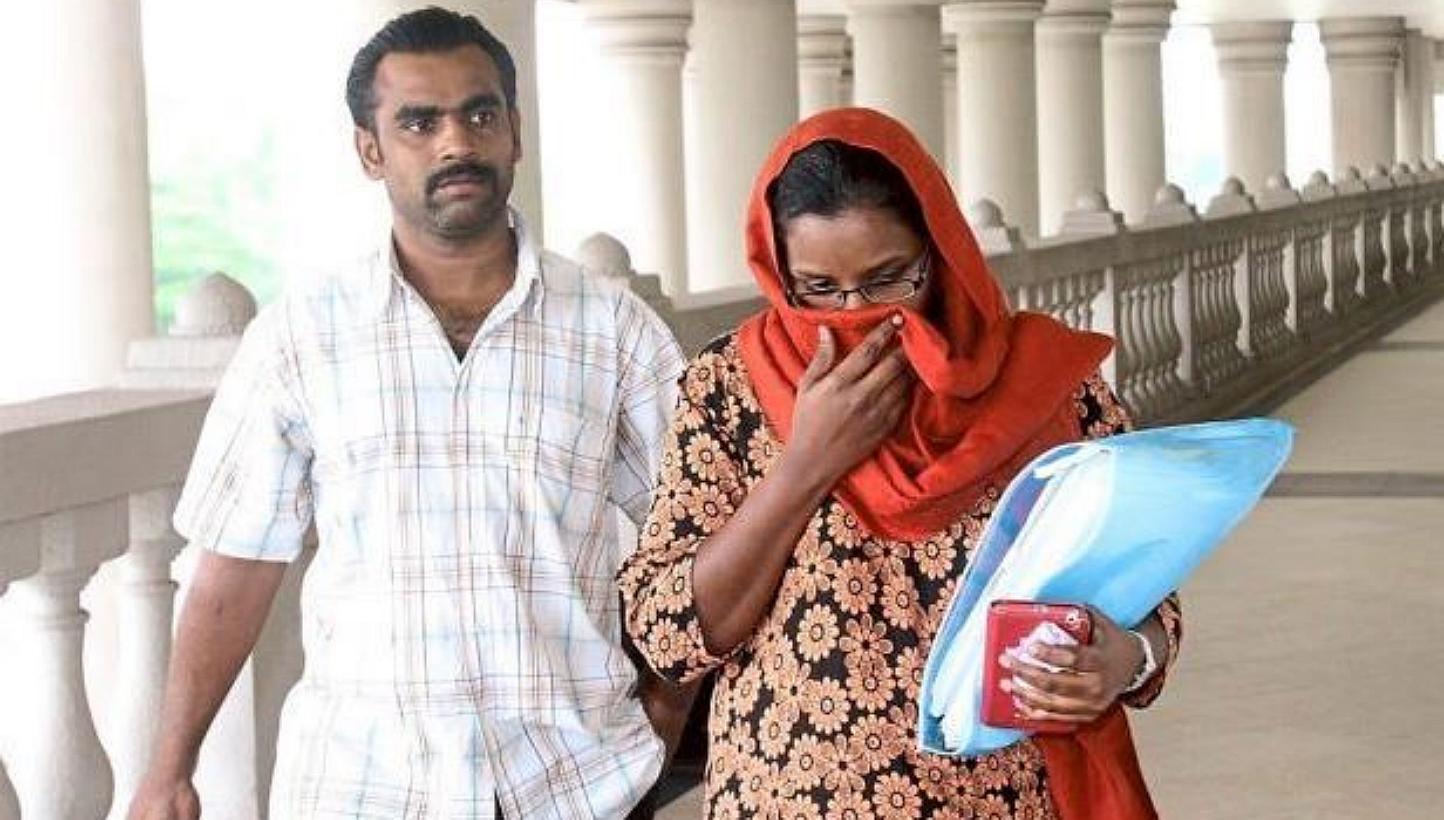 Nur Shila Kanan (right) and her husband Basheer Ahmad Maula Sahul Hameed, who stole from the bank accounts of four MH370 passengers. -- PHOTO: THE STAR/ASIA NEWS NETWORK