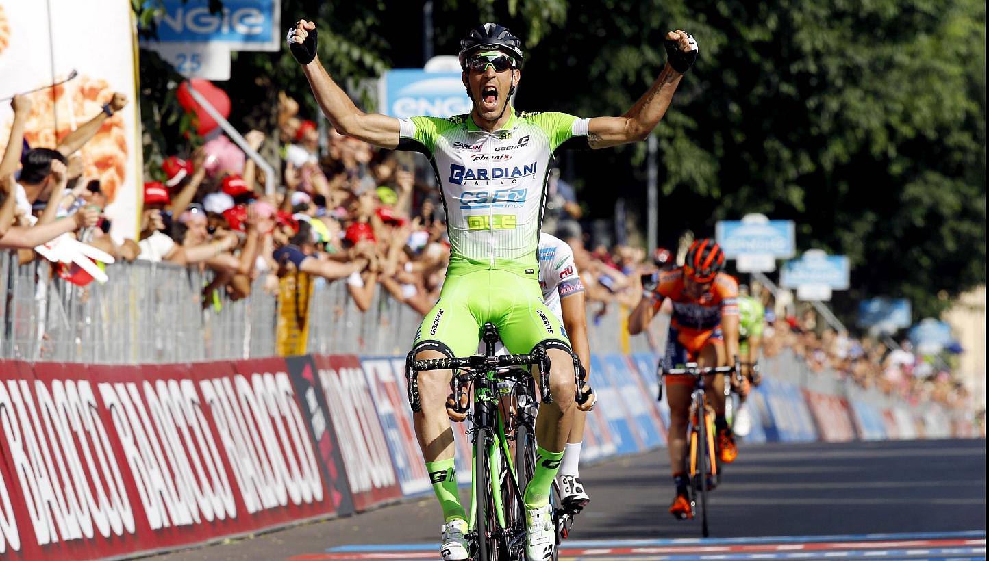 Italian cyclist Nicola Boem crosses the finish line to win the 10th stage of the 98th Giro d'Italia, Tour of Italy, 200 kms from Civitanova Marche to Forli', in Forli on Tuesday. -- PHOTO: AFP&nbsp;