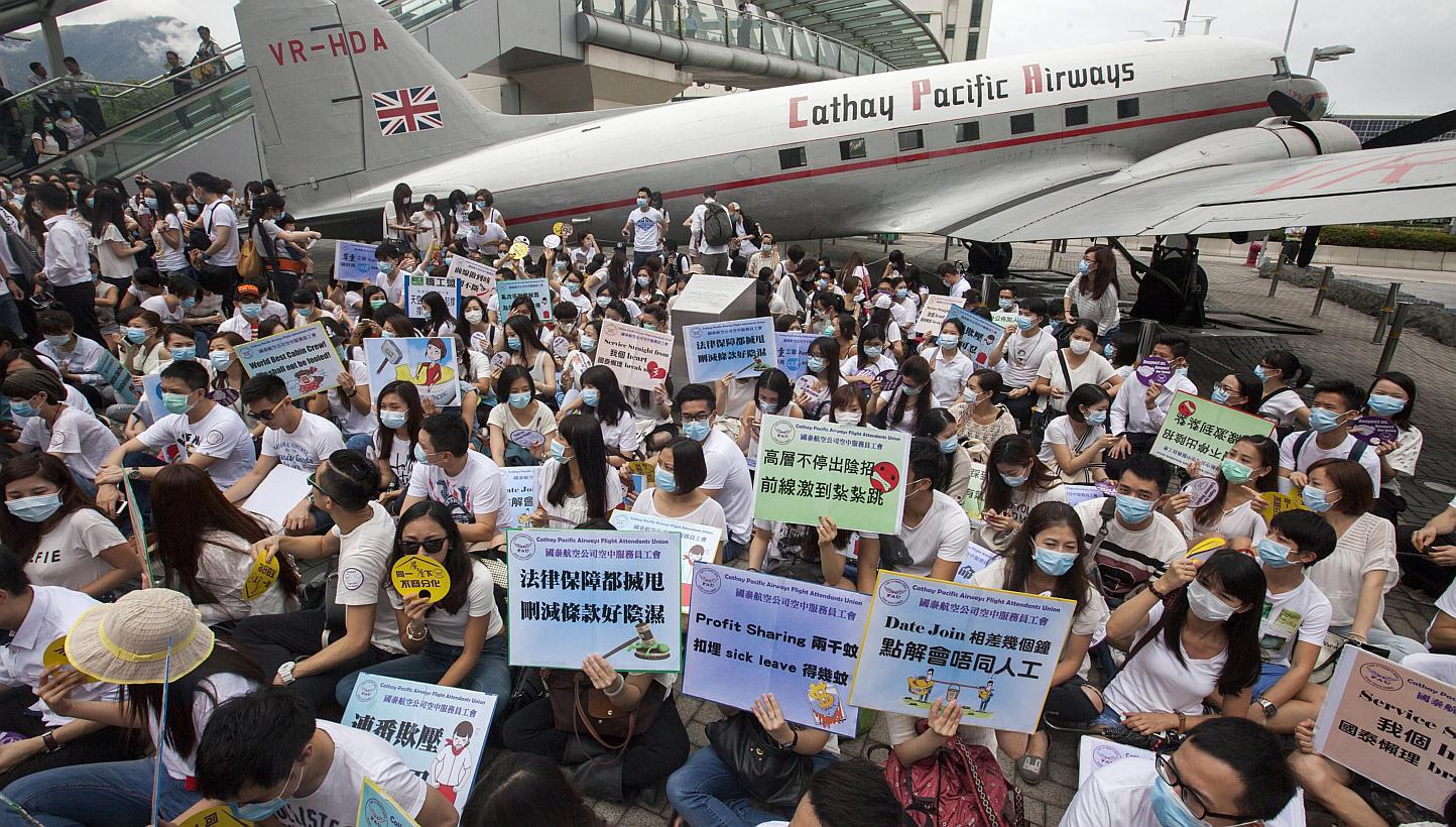 Flight attendants from Hong Kong's flag carrier airline Cathay Pacific stage a pay protest outside Cathay Pacific's management headquarters at Cathay City, Lantau Island, Hong Kong, China on&nbsp;May 21,&nbsp;2015. The Cathay Pacific Airways flight a