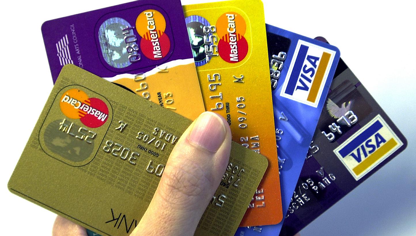 Tough new credit rules take effect in just a few days, but so far only a handful of heavily indebted people have sought help under a new scheme to cut their red ink. -- PHOTO: ST FILE