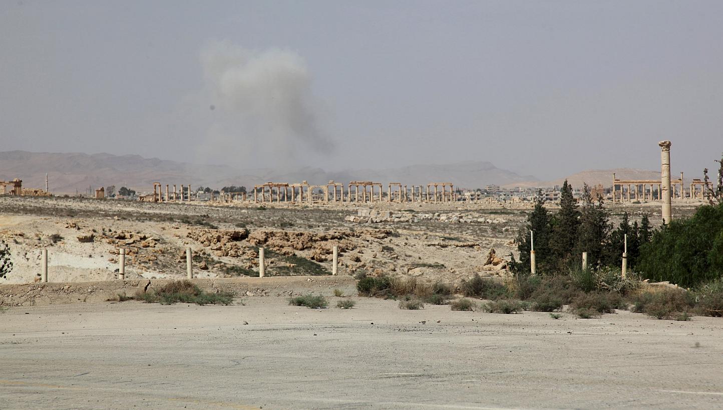 Smoke from what activists said was the result of shelling from Islamic State fighters on Palmyra city, Syria, on May 19, 2015. -- PHOTO: REUTERS