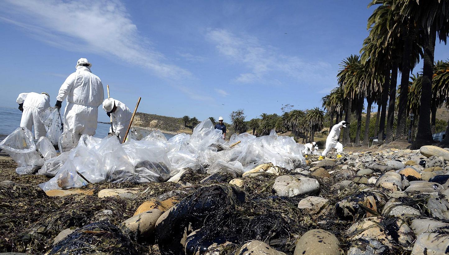 Workers clean up after an underwater oil pipe ruptured spilling an estimated 21 thousands gallons of oil into the Pacific Ocean near Refugio State Beach, 30 miles north of Santa Barbara, California, USA, May 20. Dozens of workers plied the four miles