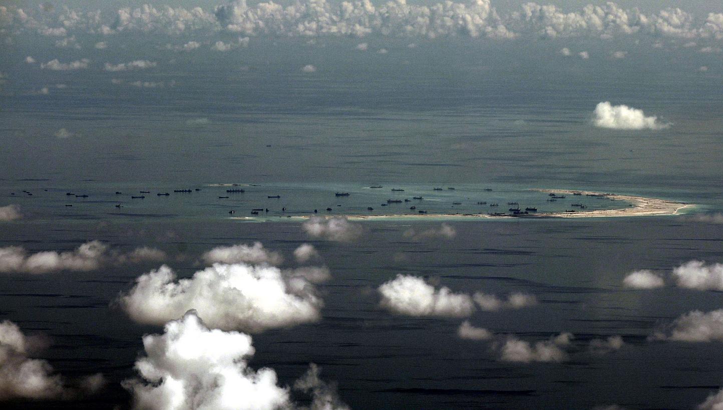 An aerial view of Mischief Reef, one of seven rocky outcrops in the Spratly islands where China is rapidly building massive artificial islands. The Chinese navy warned a US surveillance plane to leave the area eight times, according to CNN. -- PHOTO: