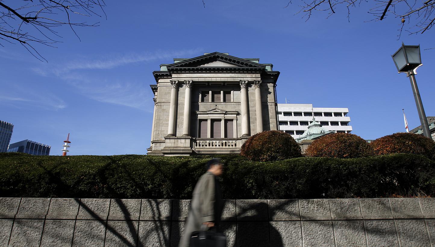 The Bank of Japan maintained its massive monetary stimulus on Friday and offered a slightly more upbeat view of the economy, unfazed by first-quarter GDP data that offered mixed signs on the strength of the recovery. -- PHOTO: BLOOMBERG
