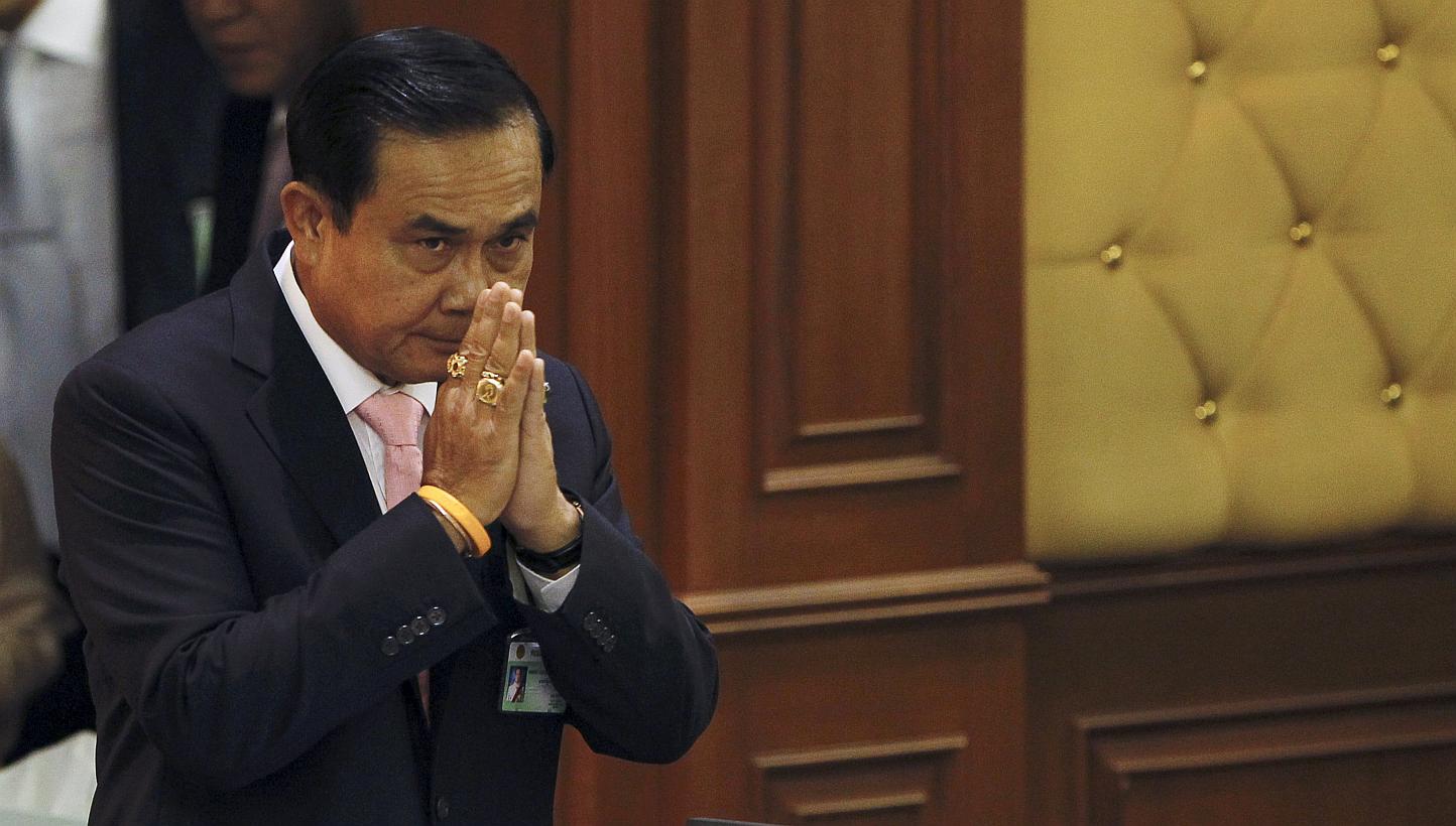 Thailand's Prime Minister Prayuth Chan-ocha gestures in a traditional greeting to National Legislative Assembly members at the parliament in Bangkok, Thailand on May 21, 2015. -- PHOTO: REUTERS