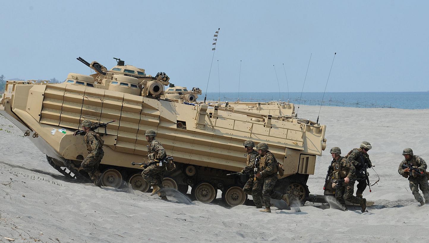 US Marines taking part in the annual Philippine-US war games in the South China Sea last month. In China's reclamation works in the Spratly Islands and America's response to them, Asia's two most important players are pushing the regional temperature