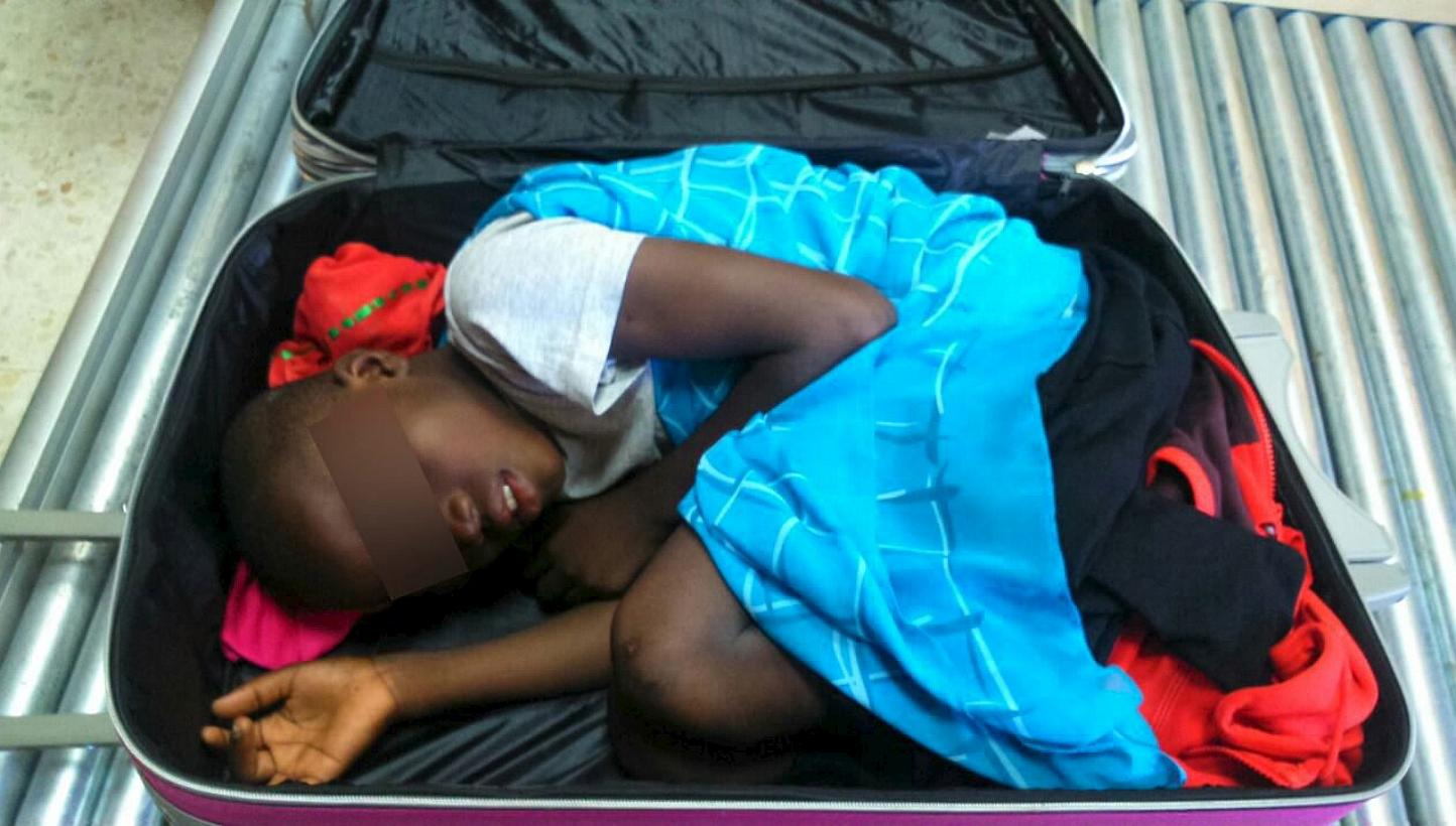 An eight-year-old boy is seen cramped inside a suitcase on a Spanish civil guard border security check point between Morocco and Spain's north african enclave Ceuta, Spain in this handout photo released May 8, 2015. -- PHOTO: REUTERS