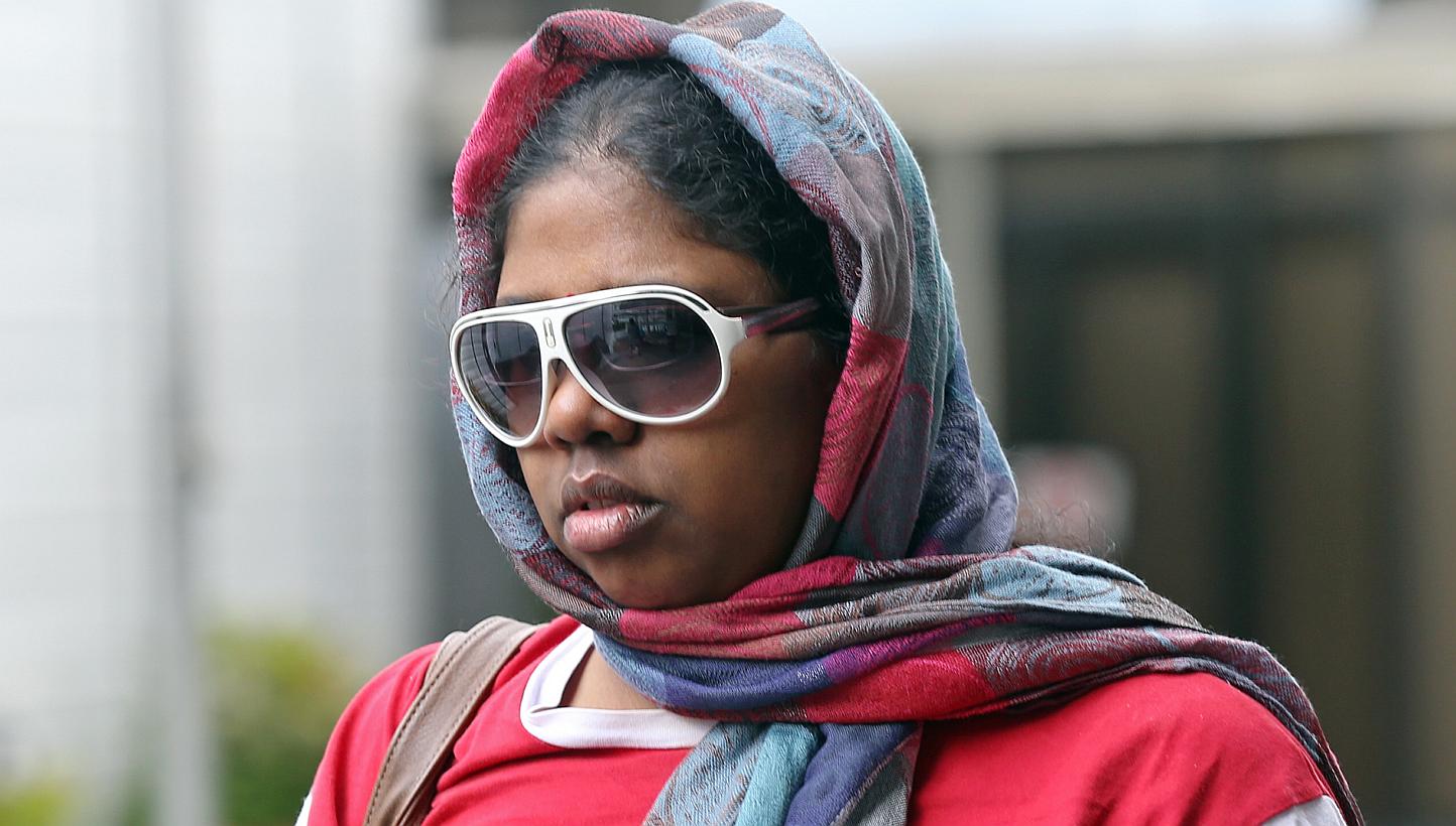 Suganthi Jayaraman, 33, who is charged with maid abuse, is photographed leaving the State Courts on May 22, 2015. She had used household items to hit and burn her domestic worker. -- ST PHOTO: SEAH KWANG PENG