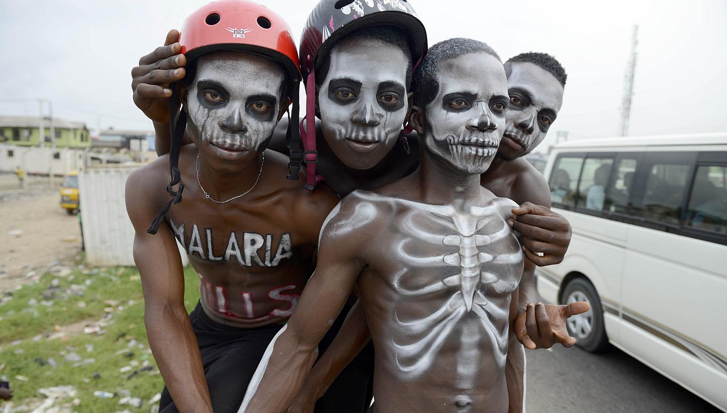 Men painted like skeleton pose on April 24, 2015, in Lagos to warn on the deadly disease prior to the World Malaria Day on April 25. Countries have agreed to rid the world of malaria almost completely over the next 15 years, the World Health Org