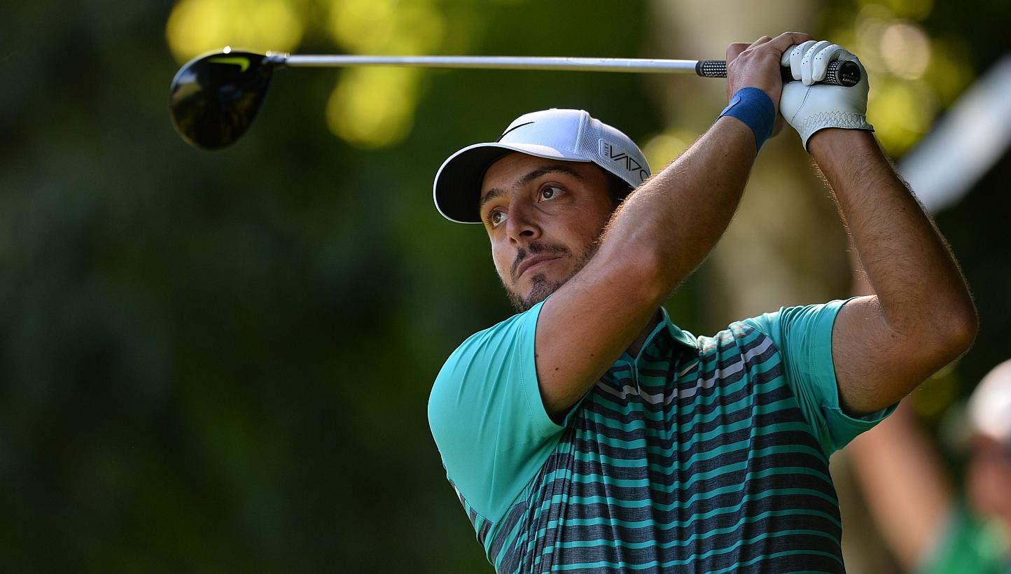 Italian golfer Francesco Molinari watches his drive from the 18th tee during the first round of the PGA Championship at Wentworth Golf Club in Surrey, south west of London, England, on May 21, 2015. -- PHOTO: AFP