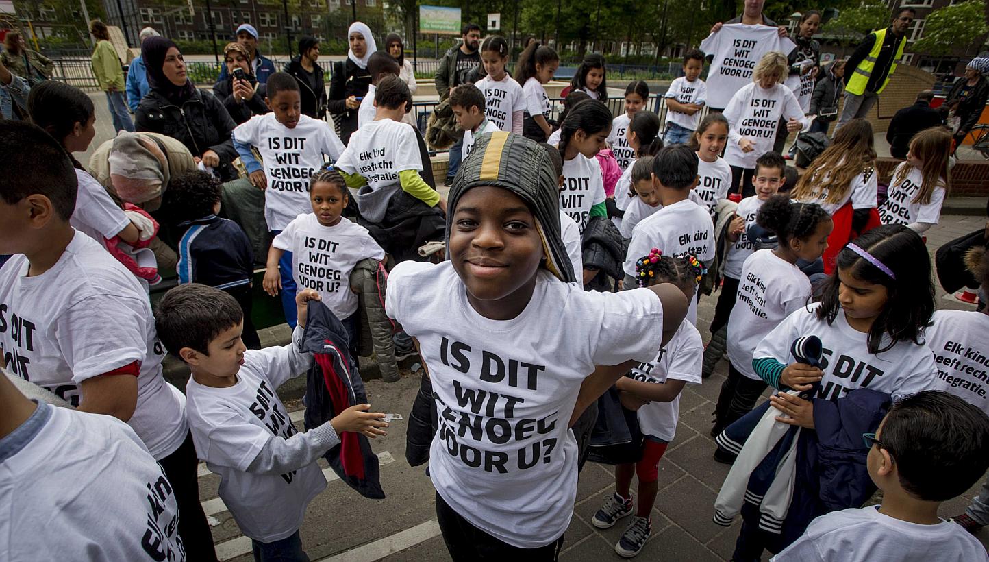 Primary school pupils in Amsterdam wearing T-shirts with the slogan: "Is this white enough for you?" preparing to distribute leaflets in Amsterdam on May 22, 2015. -- PHOTO: EPA&nbsp;