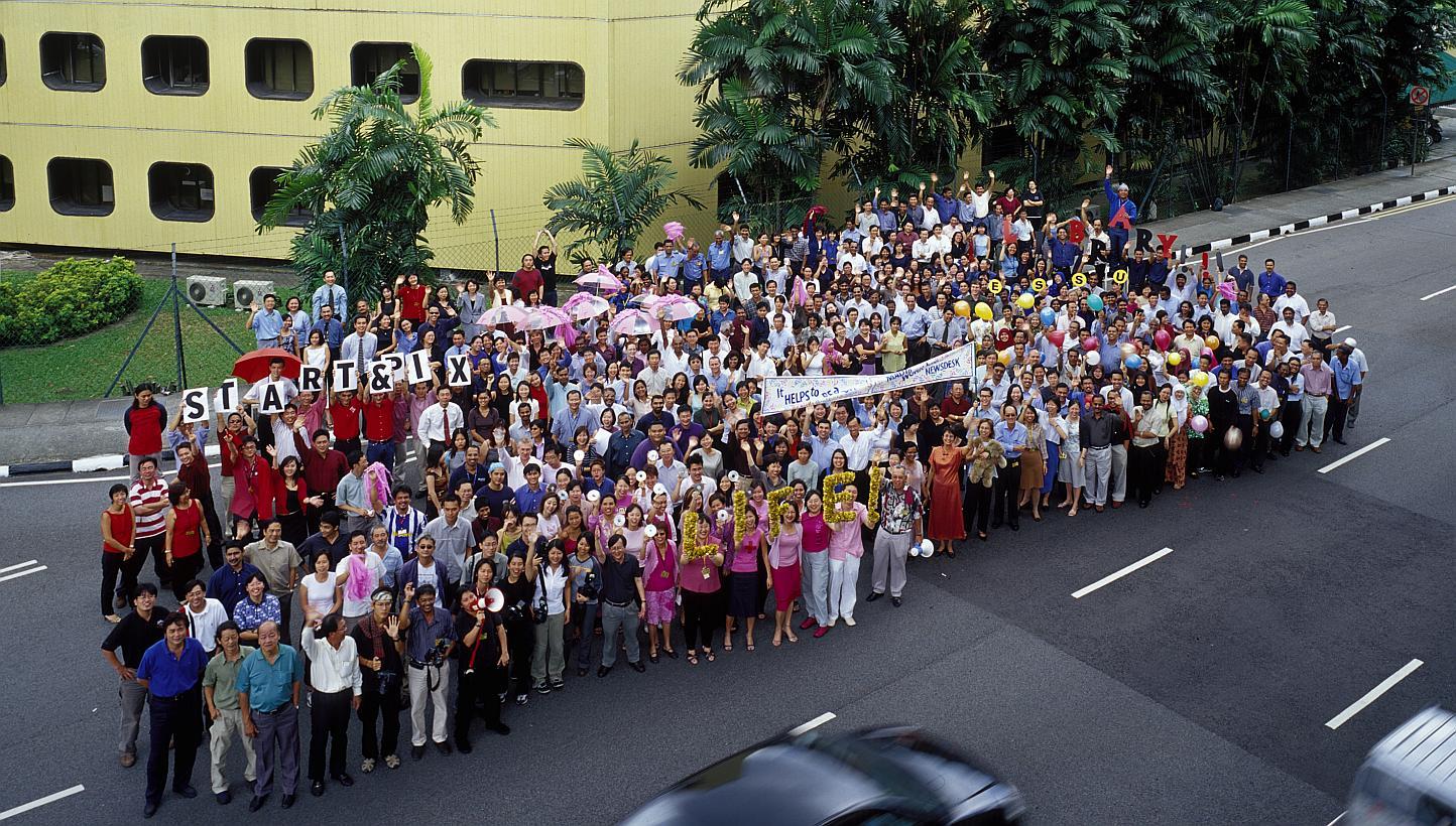 Straits Times staff gather for a group shot outside the Times House in 2002, days before the ST newsroom moved to Toa Payoh North. The iconic building had housed the ST office for more than four decades. On July 18 and 19, ST is hosting a reunion of 