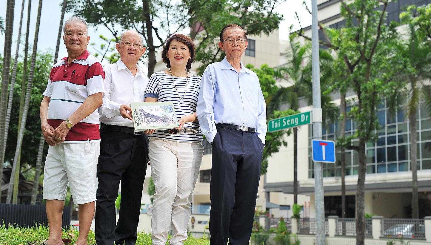 Among the contributors to the book Once Upon A Tai Seng Village are (from left) Mr Ang Mia Chaw, 73, Mr Alec Ang, 70, Ms Ann Phua, 64 - who is also the book's co-author - and Dr Stephen Chee, 78. -- PHOTO: LIM YAOHUI FOR THE STRAITS TIMES