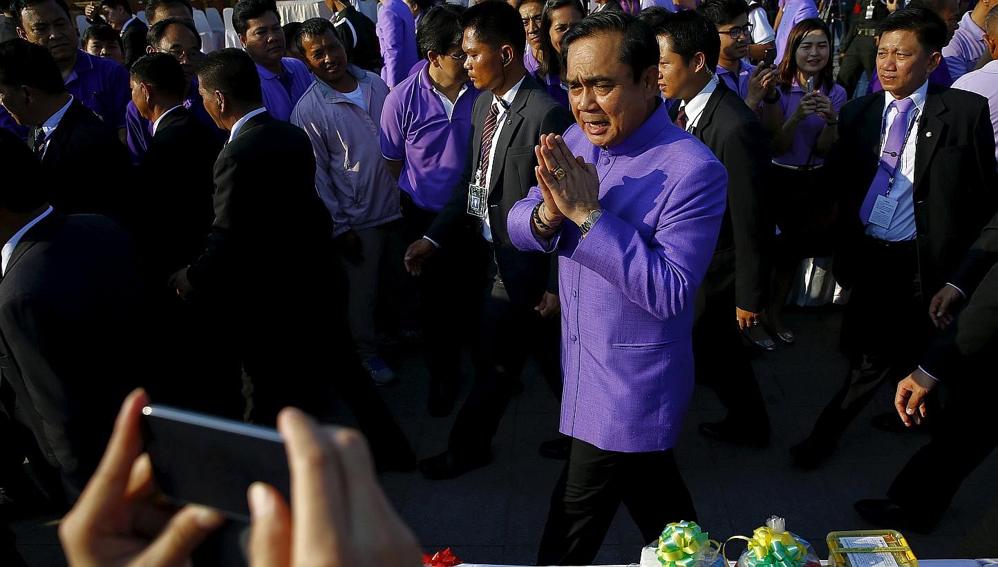Thai Prime Minister Prayut Chan-o-cha greeting the people at the birthday of Princess Maha Chakri Sirindhorn in Bangkok last month. Gen Prayut has risked alienating the large number of Thaksin supporters under martial law, a group which must be recko