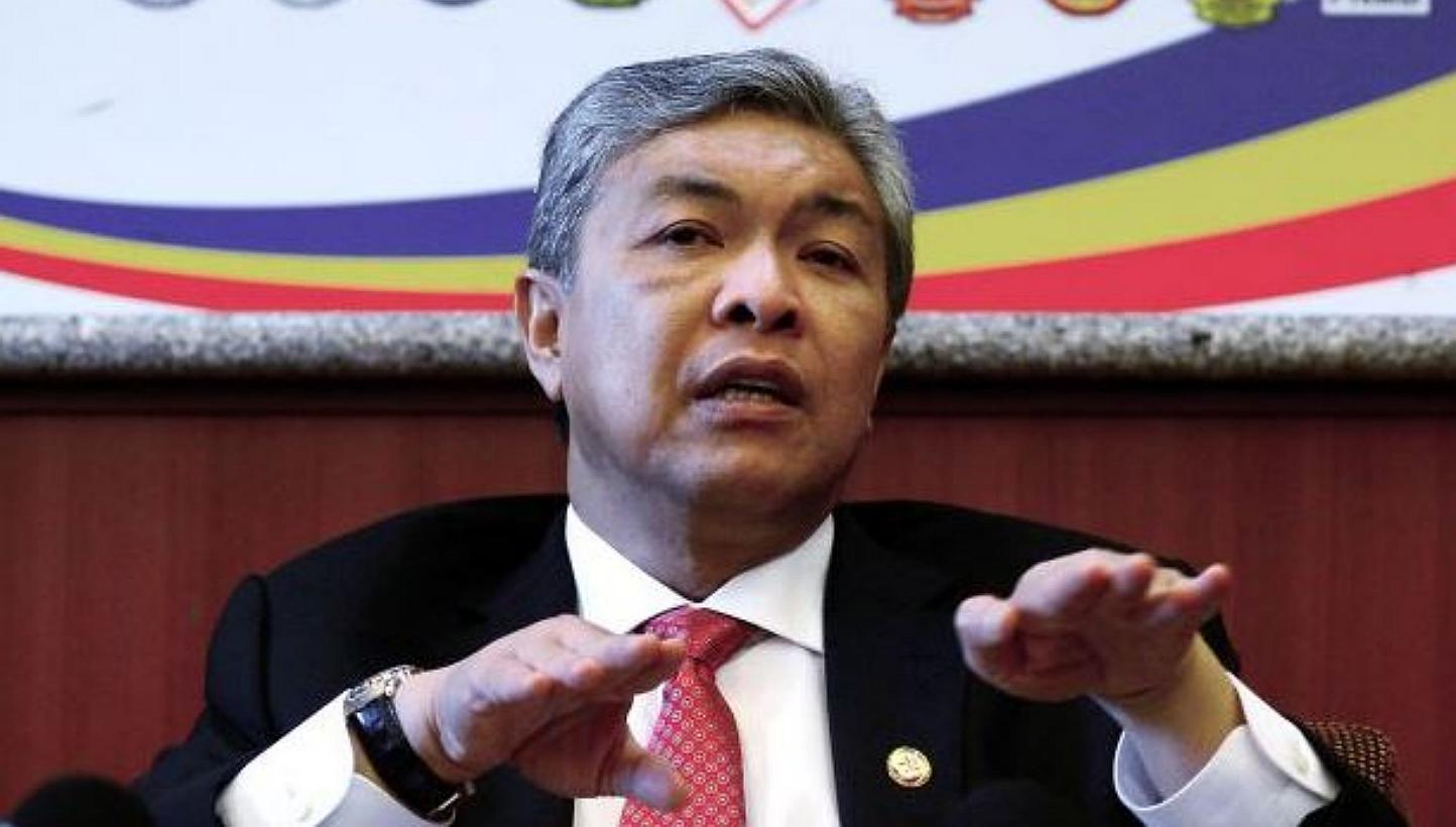 Malaysian Home Minister Ahmad Zahid Hamidi (pictured) has confirmed the unearthing of a mass grave near 17 human trafficking detention camps in Padang Besar. -- PHOTO: THE STAR/ASIA NEWS NETWORK 