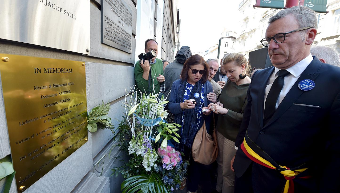 Brussels' Mayor Yvan Mayeur (right) attends a ceremony for the victims of the May 24, 2014 attack at the entrance of the Jewish Museum in Brussels, Belgium, on May 24, 2015. -- PHOTO: REUTERS 