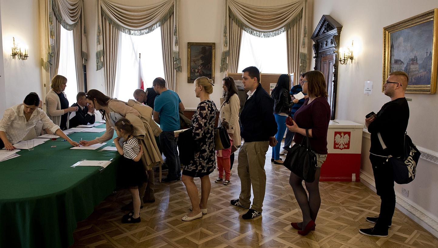 Voters wait to be registered at a polling station within the Polish Embassy in Central London, on May 24, 2015 during Poland's presidential election run-off. -- PHOTO: EPA