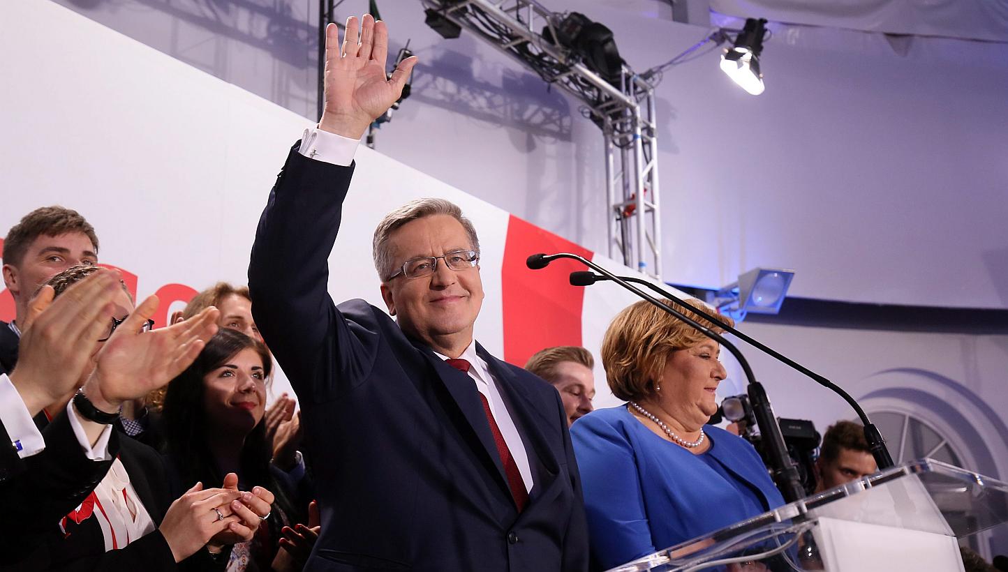 Poland's president and presidential candidate Bronislaw Komorowski (centre) speaks during the presidential elections night in Warsaw, Poland, on May 24, 2015. -- PHOTO: EPA