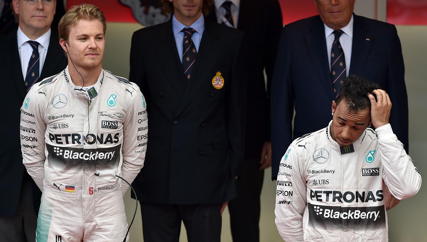 Mercedes driver Lewis Hamilton of Britain, who finished in third place at the Monaco Grand Prix, standing next to teammate and rival Nico Rosberg of Germany, who won the race, on Sunday, May 24, 2015. Hamilton was left stunned after an error robbed h