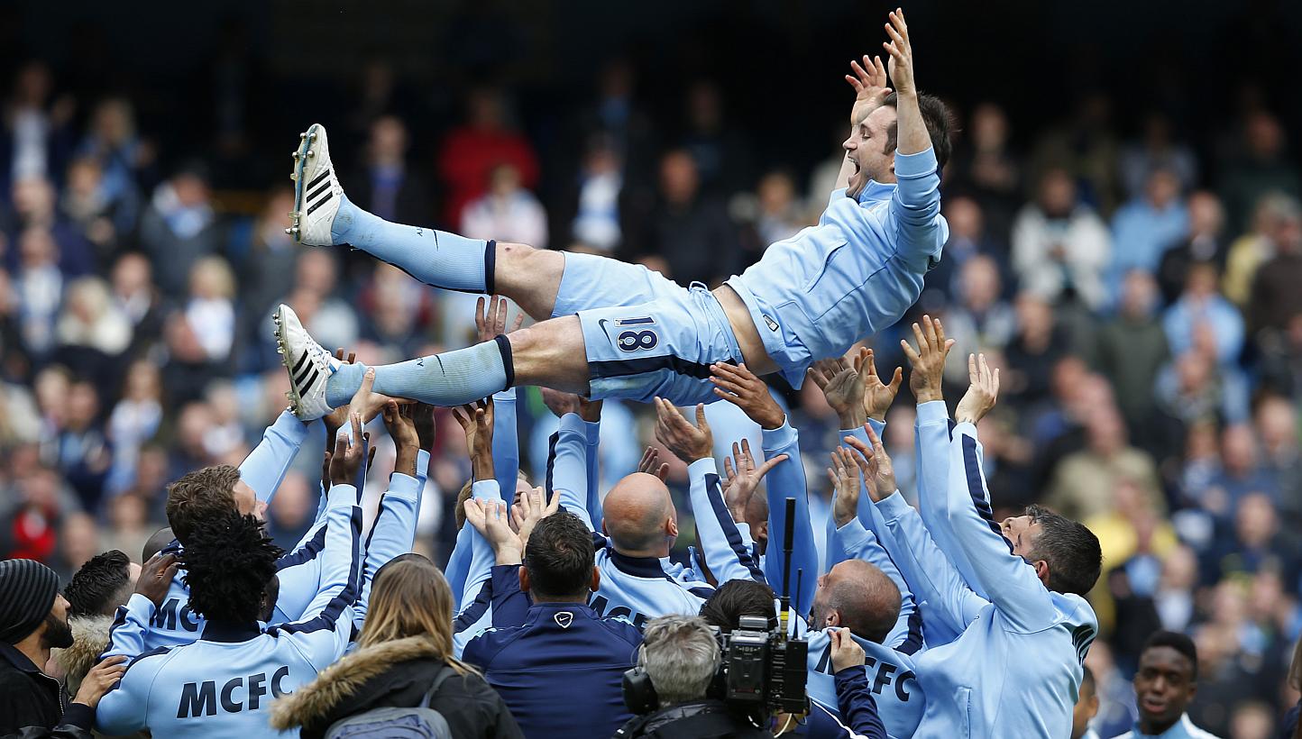 Manchester City's Frank Lampard is thrown in the air by team mates after the game between Manchester City and Southampton on May 24, 2015. -- PHOTO: REUTERS&nbsp;