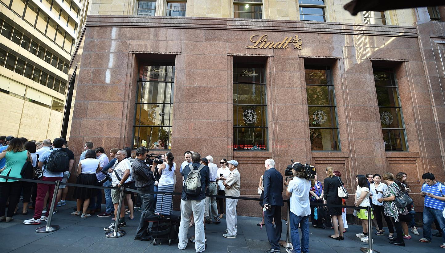 Members of the public queue outside the Lindt Cafe at Martin Place in Sydney ahead of the re-opening on March 20, 2015.&nbsp;&nbsp;A self-styled sheikh who staged a siege at the cafe last year suffered "grandiose delusions" and was once kicked out of