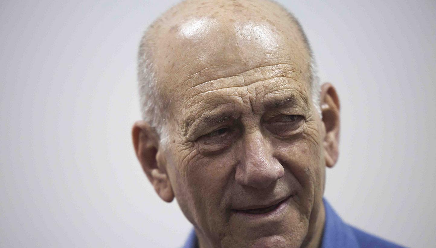 Former Israeli Prime Minister Ehud Olmert appears in Jerusalem District Court on May 25,2015.&nbsp;Former Israeli prime minister Ehud Olmert was sentenced on Monday to eight months' jail for accepting illegal payments from a United States businessman
