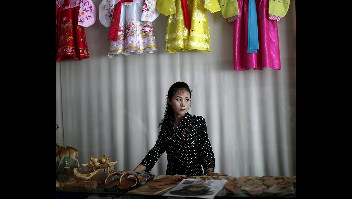 A woman manning a gift shop in Rason city, part of the special economic zone north-east of Pyongyang. North Korea may be a male-dominated society, but it is women who are making the money. They earn more than 70 per cent of household income in North 