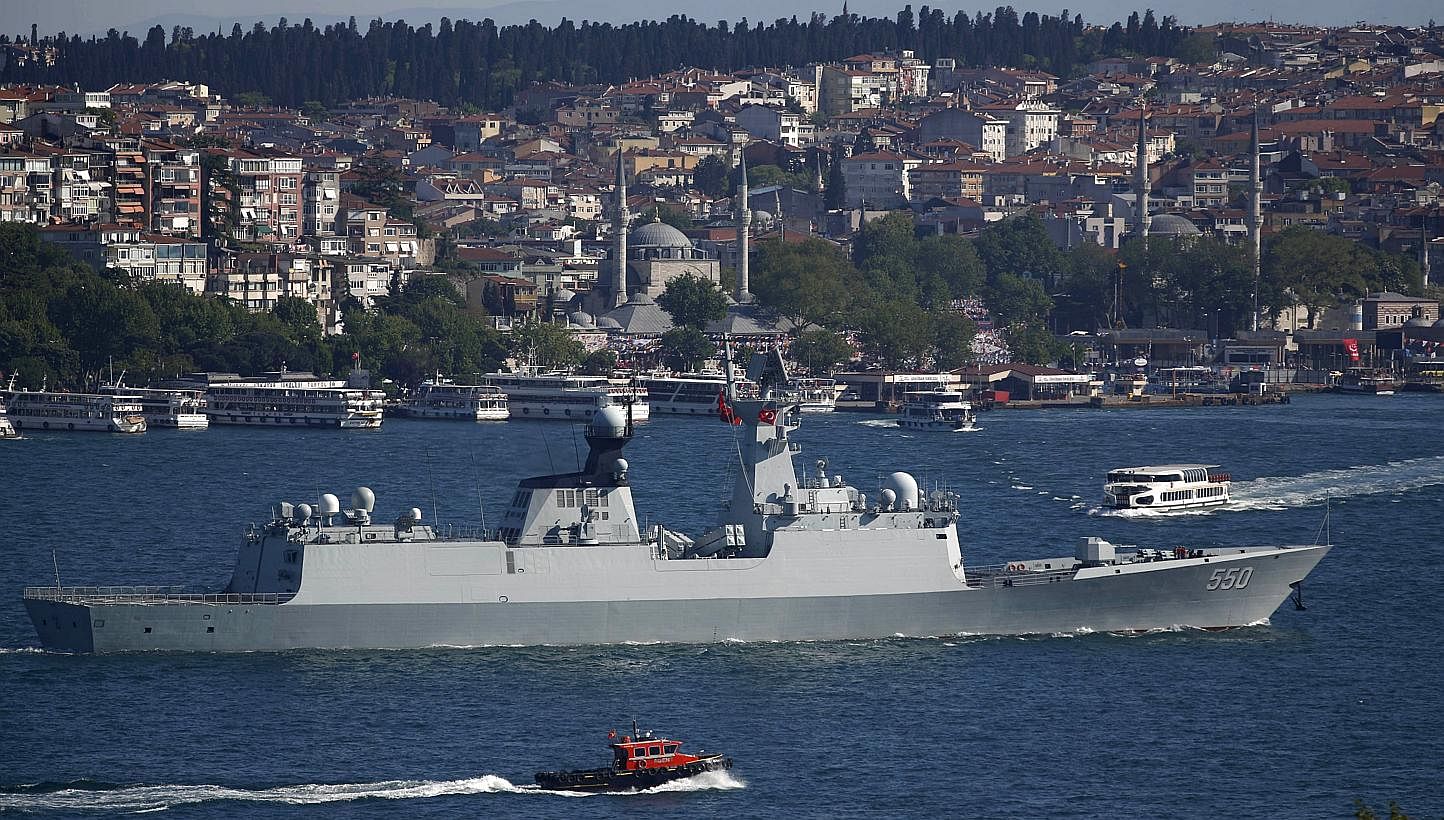 The People's Liberation Army (PLA) navy frigate Weifang setting sail in the Bosphorus, on its way to the Mediterranean Sea in Istanbul, Turkey on May 14, 2015. China has outlined an expanded role for its military and particularly its navy as it seeks