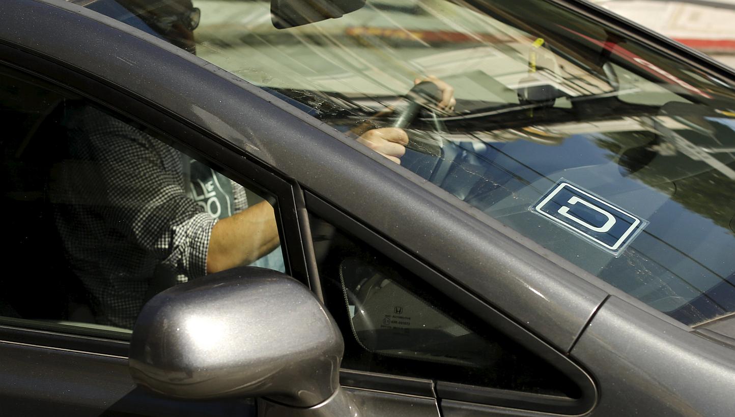 An Uber logo shown on a vehicle in San Francisco, California on May 7, 2015. -- PHOTO: REUTERS&nbsp;